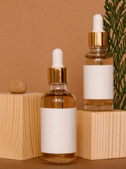 Cosmetic dropper bottles with gold caps